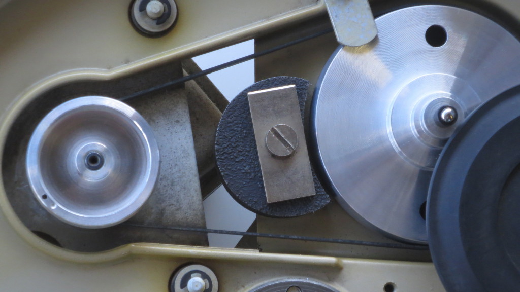 A close view of pulleys and eddy-current braking magnet.
